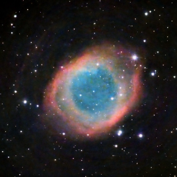 The Helix Nebula (NGC 7293) in Aquarius is the closest planetary nebula to Earth β the glowing shell of gas expelled by a dying Sun-like star. Its central white dwarf will eventually cool to the same fate awaiting our Sun. How far away is the Helix Nebula?