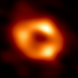 Sagittarius A* is the supermassive black hole at the center of the Milky Way, imaged by the Event Horizon Telescope in 2022. The stars nearest to it orbit in only 15-16 years, reaching speeds of 7,650 km/s. How far from Earth is Sagittarius A*?